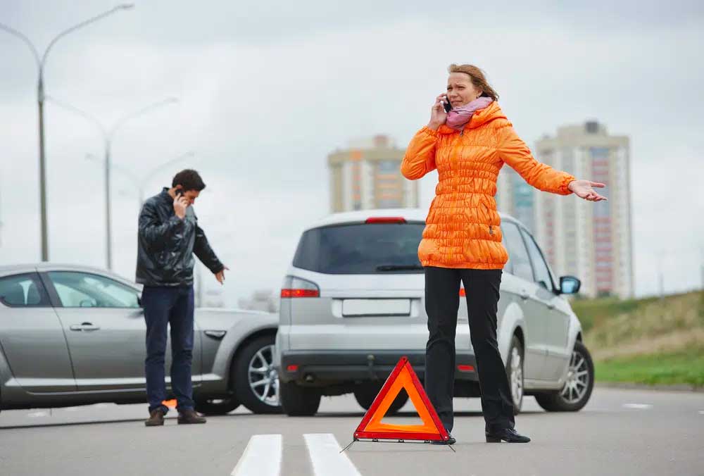 Injured in a car accident, lady calling calling phoenix car accident attorneys for suing multiple defendants for damages in car wrecks