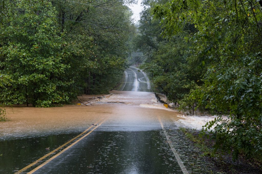 A flooded road can lead to car accidents.